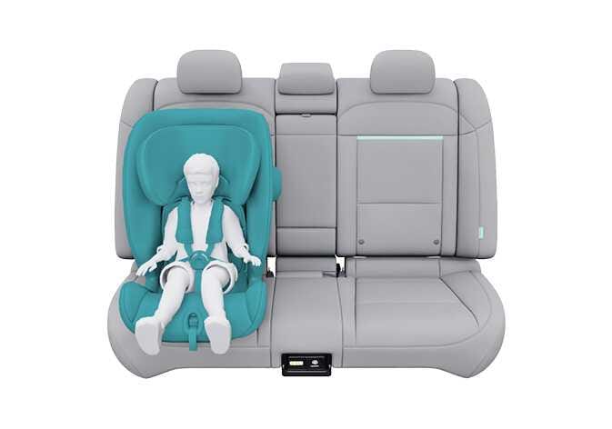 2026 Kia Tasman Forward-facing Child Restraint System image. A child dummy is seated facing forward in a child safety seat highlighted in teal on the rear seat, secured with a harness. Explains the configuration of a forward-facing child restraint system.