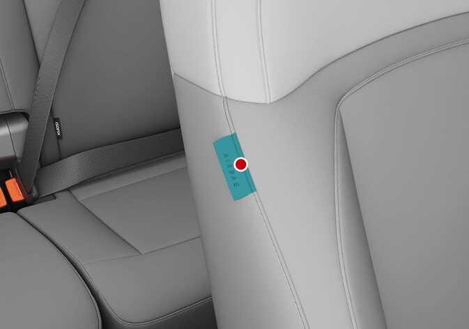 2026 Kia Tasman side airbag location image. The 'AIRBAG' label sewn into the side seam of the front seat backrest is highlighted in teal, with a red dot indicating its position. Explains the installation location of the side airbag within the seat.