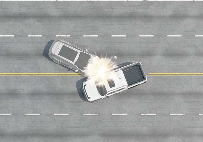 2026 Kia Tasman angled collision scenario image. A top-down view shows a grey vehicle colliding with the front side of a white pickup truck at an angle, indicated by a bright impact flash. It illustrates a condition where airbags may not deploy because the impact force sends occupants in a direction where airbags offer no benefit.