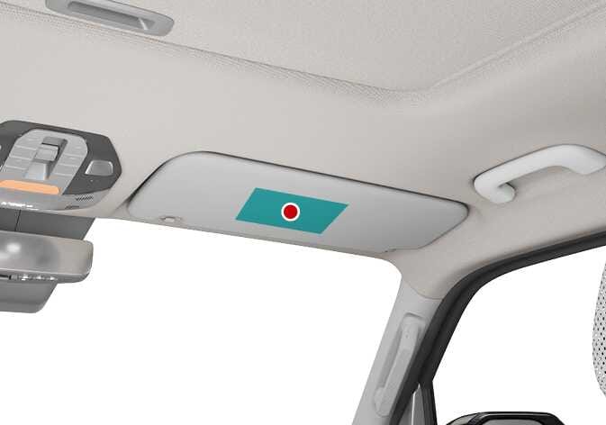 2026 Kia Tasman air bag warning label location image. The passenger side sun visor features a rectangular area highlighted in teal with a red circle icon. This describes the location of the air bag warning label attached to the sun visor.