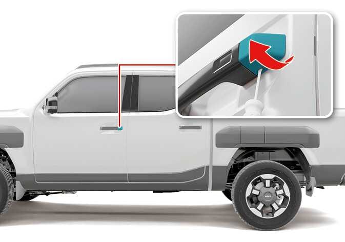 2026 Kia Tasman door handle cover removal image. A close-up shows the rear door handle with a teal-highlighted cover. A tool is inserted at the bottom, and a red curved arrow points upward to indicate the removal direction. This explains the function of removing the cover to access the mechanical key hole.
