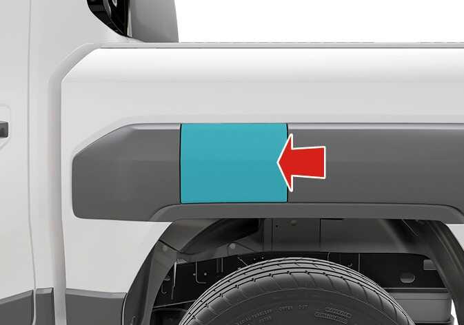2026 Kia Tasman fuel filler door operation image. The fuel filler door located above the rear wheel is highlighted in cyan, and a red arrow points to its rear center edge. Explains the function of opening or closing the fuel filler door by pressing the indicated area.