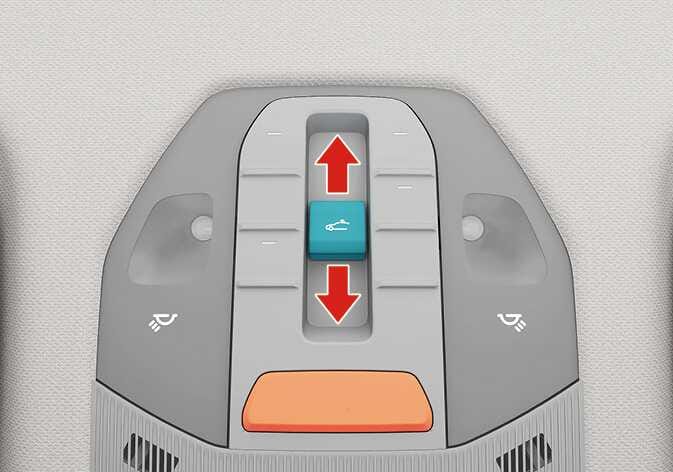 2026 Kia Tasman sunroof slide control switch image. The sunroof switch on the overhead console is highlighted in teal, with red vertical arrows indicating the forward and rearward operation directions. Explains the function of sliding the sunroof glass and sunshade open or closed by pushing the switch.