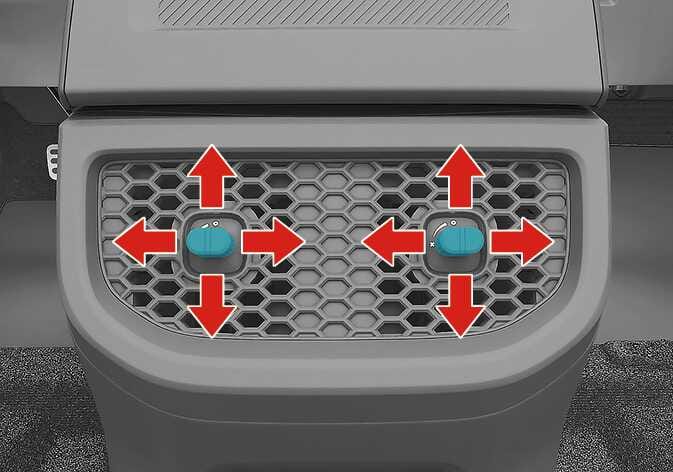 2026 Kia Tasman air vent adjustment image. The central control knobs on the honeycomb vents are highlighted in teal. Red arrows pointing up, down, left, and right indicate the operation direction. Explains the function of adjusting the air flow direction by moving the knobs.