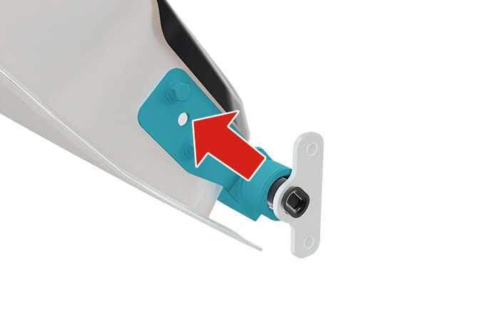 2026 Kia Tasman tailgate hinge pin image. The hinge bracket is highlighted in teal. A red arrow points from the T-shaped hinge pin towards the hole in the bracket. This explains the process of inserting the hinge pin to install the tailgate.