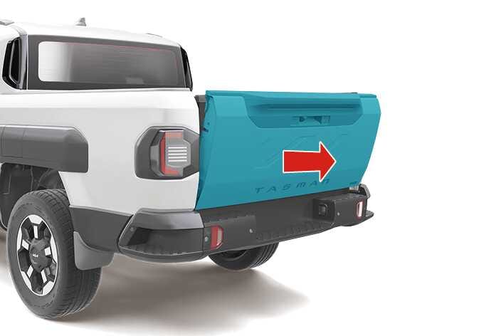 2026 Kia Tasman tailgate removal image. The tailgate is highlighted in teal, and a large red arrow points to the right. This illustrates the direction to slide the tailgate to detach it from the vehicle.