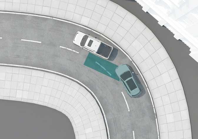 2026 Kia Tasman Blind-Spot Collision-Avoidance Assist limitation image. A top-down view shows a white vehicle on a curved road with a grey vehicle in the adjacent lane. A teal-shaded area extending from the white vehicle's rear indicates the sensor detection range. Explains the limitation where the system may not properly detect vehicles in the next lane while driving on a curved road.