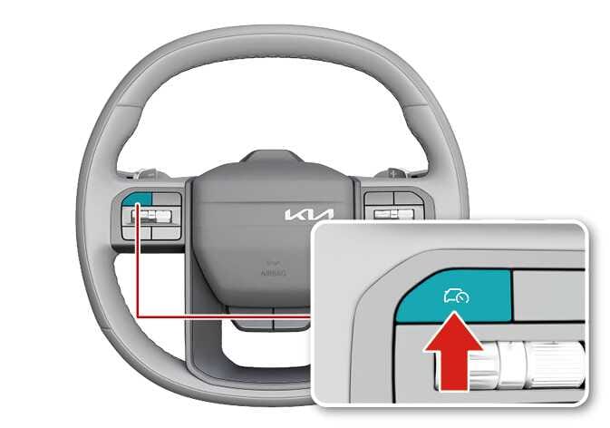2026 Kia Tasman steering wheel control image. The Driving Assist button on the left spoke is highlighted in teal. A magnified inset shows a red arrow pointing to the button with a car and speedometer icon. Explains the function of pressing the button to turn off the Manual Speed Limit Assist.