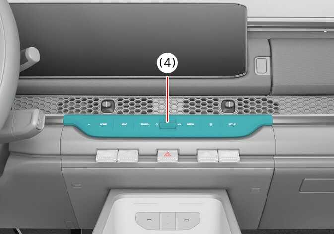 2026 Kia Tasman Infotainment system power button image. The control panel below the infotainment screen is highlighted in teal, with a callout number (4) indicating the central power button. Explains the location of the button that can be pressed to turn off the rear view monitor.