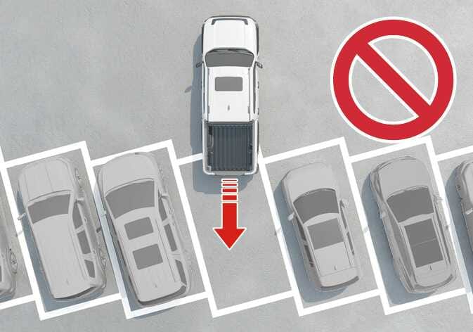 2026 Kia Tasman Remote Smart Parking Assist limitation image. It displays a white vehicle positioned straight in a diagonal parking lot, with a red arrow indicating movement and a red prohibition symbol overlaid. This explains the limitation that the function cannot be used in diagonal parking spaces.