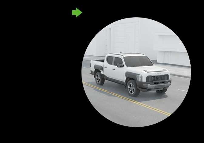 2026 Kia Tasman Blind-Spot View Monitor image. A white vehicle is shown inside a circular display with a green arrow pointing to the left. This explains the function of displaying the left rear blind spot area in the cluster when the left turn signal is turned on.