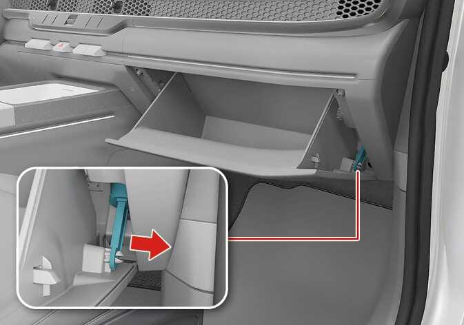 2026 Kia Tasman glove box support rod image. An inset displays the support rod highlighted in cyan on the right side. A red arrow indicates pulling right to detach the rod. This describes disconnecting the rod to replace the climate control air filter.