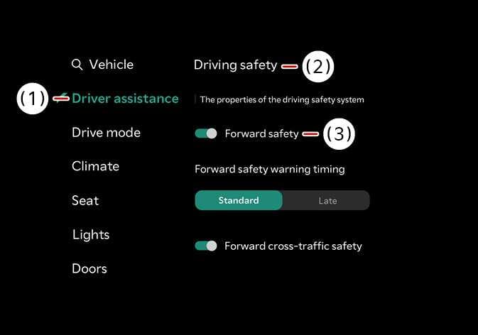 2026 Kia Tasman infotainment system settings screen image. The screen displays (1) Driver assistance selected in the menu. The (2) Driving safety section shows the (3) Forward safety toggle switch. This describes the menu path to configure the Forward safety function.