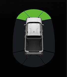 2026 Kia Tasman Forward Parking Distance Warning indicator image. A top-down view of the vehicle is shown with green arc-shaped zones illuminated in front of the vehicle. This explains the visual warning displayed on the instrument cluster when an object is detected at a distance of 60 to 120 cm.