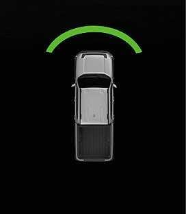 2026 Kia Tasman Forward Parking Distance Warning infotainment display image. A green arc appears in front of the vehicle in a top-down view. Explains the warning shown when an object is detected at a distance of 60 to 120 cm (24 to 48 in).