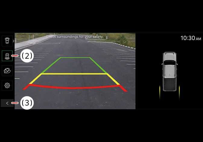 2026 Kia Tasman Surround View Monitor rear view screen image. The display shows the rear camera feed with green, yellow, and red parking guidelines. The View switching button (2) is highlighted on the left menu, and the Back button (3) is marked at the bottom. The right side shows a top-down vehicle graphic. Explains the rear view layout and view switching function.