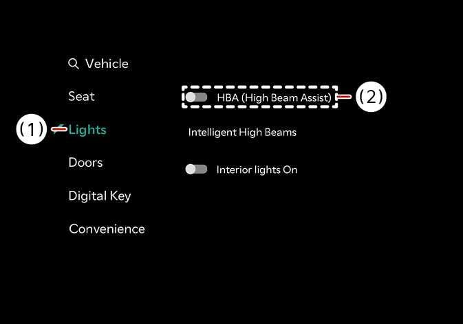 2026 Kia Tasman High Beam Assist settings screen image. The '(1) Lights' menu is selected and highlighted in teal on the left sidebar. The '(2) HBA (High Beam Assist)' option is enclosed in a dashed box with the toggle switch turned on. Explains the function of enabling the High Beam Assist feature through the vehicle settings menu.