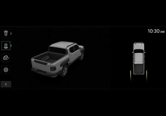 2026 Kia Tasman Surround View Monitor 3D view screen image. The infotainment screen displays a 3D perspective view of the vehicle from the rear-left angle on the left and a top-down view with yellow guidelines on the right. On the left vertical menu bar, the 3D view icon is highlighted in green. Explains the function that shows the surroundings of the vehicle from various angles.