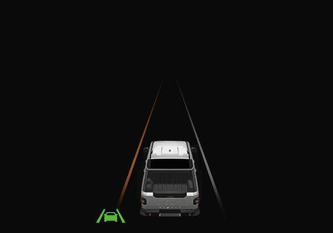 2026 Kia Tasman Lane Departure Warning image. A top-down view of the white vehicle shows the left lane marker highlighted in orange, while the right lane marker is white. A green Lane Keeping Assist icon is displayed in the bottom left corner. Explains the visual warning provided when the vehicle departs from its lane.