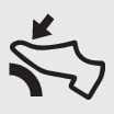 2026 Kia Tasman press brake pedal indicator icon. The symbol displays a foot pressing down on a pedal with a downward arrow above it. Indicates the requirement to depress the brake pedal to start the engine or shift the gear.