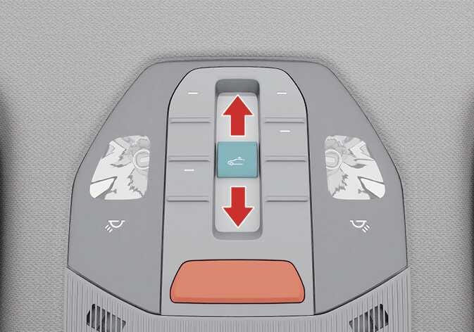 2026 기아 타스만 선루프 슬라이드 개폐 조작 이미지입니다. 오버헤드 콘솔 중앙에 청록색으로 강조된 선루프 스위치가 있고, 스위치 위아래로 붉은색 화살표가 표시되어 있습니다. 스위치를 앞뒤 방향으로 움직여 선루프 글라스와 선블라인드를 열고 닫는 기능을 설명합니다.
