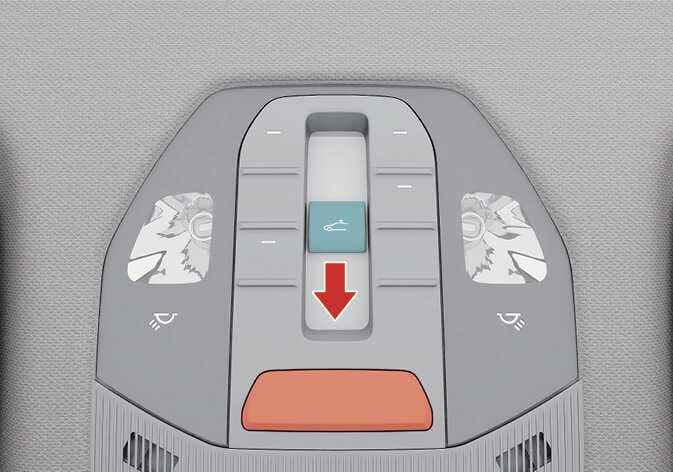 2026 기아 타스만 오버헤드 콘솔의 선루프 조절 스위치 이미지입니다. 중앙에 위치한 스위치가 청록색으로 강조되어 있으며, 붉은색 화살표가 스위치 조작 방향을 아래쪽으로 가리키고 있습니다. 선루프가 정상적으로 작동하지 않을 때 초기화하는 기능을 설명합니다.