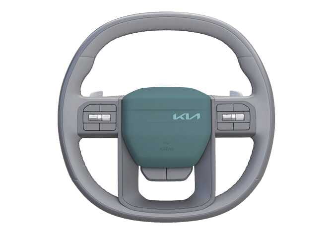 2026 기아 타스만 스티어링 휠의 경음기 작동 위치를 나타내는 이미지입니다. 기아 로고가 위치한 스티어링 휠 중앙의 패드 전체가 청록색으로 강조되어 있습니다. 강조된 작동 영역을 눌러 경적음을 울리는 기능을 설명합니다.