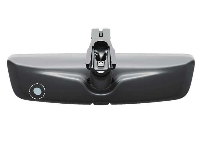 2026 기아 타스만 디지털 센터 미러 후면 이미지입니다. 미러 뒷면 좌측 하단에 위치한 센서 부위가 청록색으로 강조된 점선 원으로 표시되어 있습니다. 광센서의 오작동을 방지하기 위해 해당 센서를 가리거나 만지지 않도록 주의해야 하는 위치를 설명합니다.