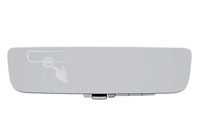 2026 기아 타스만 디지털 센터 미러 이미지입니다. 미러 하단에 위치한 메뉴 버튼을 손가락으로 누르는 동작이 흰색 원과 손 아이콘으로 강조되어 있습니다. 메뉴 버튼을 눌러 디스플레이 밝기와 표시 화면의 위아래 각도를 조절할 수 있는 설정 모드로 진입하는 기능을 설명합니다.