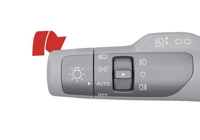 2026 기아 타스만 조명 스위치 레버 이미지입니다. 레버의 회전 스위치에 OFF, AUTO, 미등, 전조등 아이콘이 표시되어 있으며, 굵은 빨간색 화살표가 스위치를 돌리는 방향을 지시하고 있습니다. 스위치를 돌려 조명을 AUTO(자동 켜짐) 위치로 설정하는 기능을 설명합니다.
