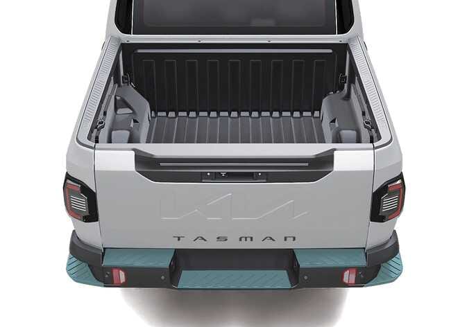 2026 기아 타스만 리어 범퍼 스텝 이미지입니다. 차량 후면 범퍼의 좌우 양쪽 모서리에 위치한 발판 부위가 청록색으로 강조되어 있습니다. 적재함을 편리하게 이용하기 위해 발을 딛고 올라설 수 있는 리어 범퍼 스텝의 위치를 설명합니다.