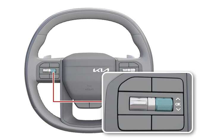 2026 기아 타스만 스티어링 휠 OK 버튼 조작 이미지입니다. 스티어링 휠 좌측 스포크에 위치한 버튼을 붉은색 선으로 연결하여 확대한 상세도가 포함되어 있습니다. 상세도에는 청록색으로 강조된 스크롤 휠과 위아래 화살표, OK 문구가 표시된 버튼이 있습니다. N단 유지 모드 설정을 위해 OK 버튼을 조작하는 기능을 설명합니다.