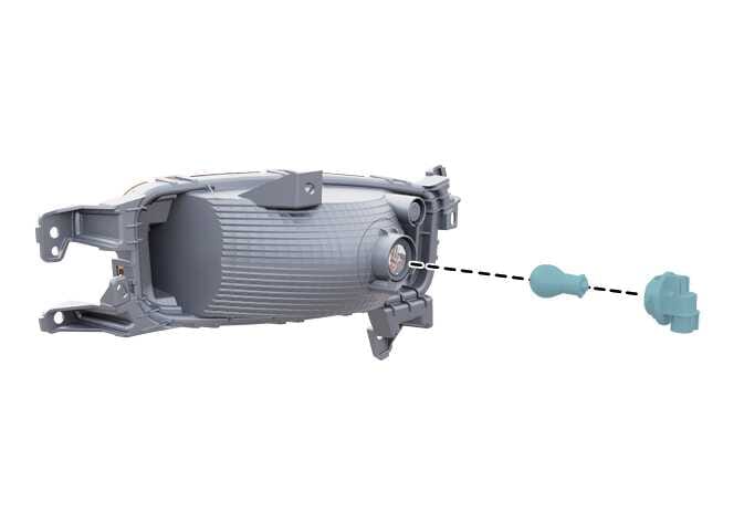 2026 기아 타스만 앞면 방향지시등 전구 교체 이미지입니다. 헤드램프 어셈블리 후면에서 청록색으로 강조된 전구 소켓이 분리된 모습을 보여줍니다. 검은색 점선이 소켓의 장착 위치와 결합 경로를 안내하고 있으며, 전구 교체를 위해 소켓을 분리하거나 장착하는 위치를 설명합니다.