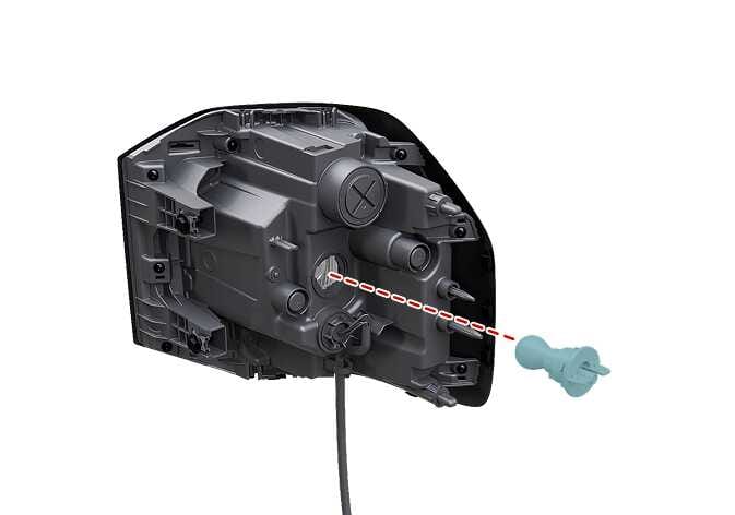 2026 기아 타스만 뒷면방향지시등 전구 소켓 분리 이미지입니다. 리어 콤비네이션 램프 뒷면에서 청록색으로 강조된 방향지시등 소켓이 붉은색 점선을 따라 램프 본체 바깥으로 분리되는 모습을 상세하게 보여줍니다. 소켓을 시계 반대 방향으로 돌려 램프 본체에서 탈거하는 과정을 설명합니다.