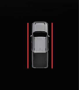 2026 기아 타스만 측방 주차 거리 경고 인포테인먼트 화면 이미지입니다. 차량 위에서 본 모습 양옆에 붉은색 실선이 차체에 가깝게 표시되어 있습니다. 물체와의 거리가 약 30 cm 이내일 때 인포테인먼트 시스템에 나타나는 경고 표시 화면을 설명합니다.