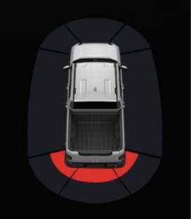 2026 기아 타스만 클러스터 후방 주차 거리 경고 이미지입니다. 차량 후방 범퍼에 맞닿은 부채꼴 영역이 붉은색으로 표시되어 있습니다. 후방 물체와의 거리가 30 cm 이내일 때의 경고 화면을 보여주며, 장애물이 차량에 매우 근접해 있음을 알리는 기능을 설명합니다.
